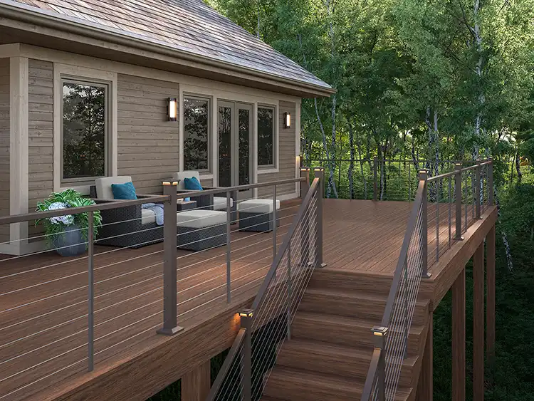 deckorators-voyage-decking-mesa-contemporary-cable-railing-weathered-brown-brown-house Photo of deck made with Deckorators Voyage Decking