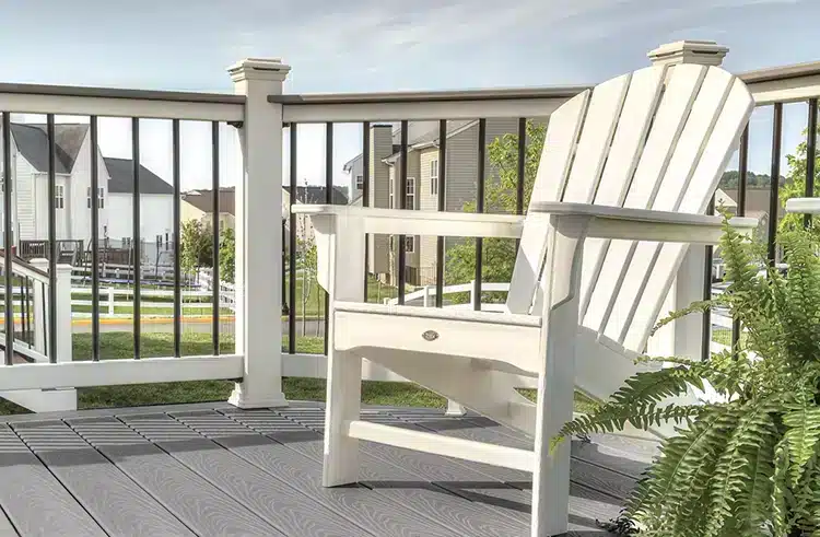 sel-round-hill-006-pg-cocktail-rail-adirondack-vignette-flipped_Article-Image-Main Photo of deck with Trex Select deck boards