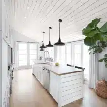 Photo of Rustic Collection White Shiplap And Trim in contemporary kitchen with an island
