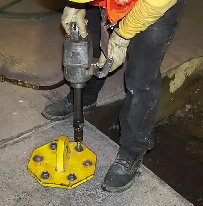 Photo of Concrete Screw being drilled into concrete pad