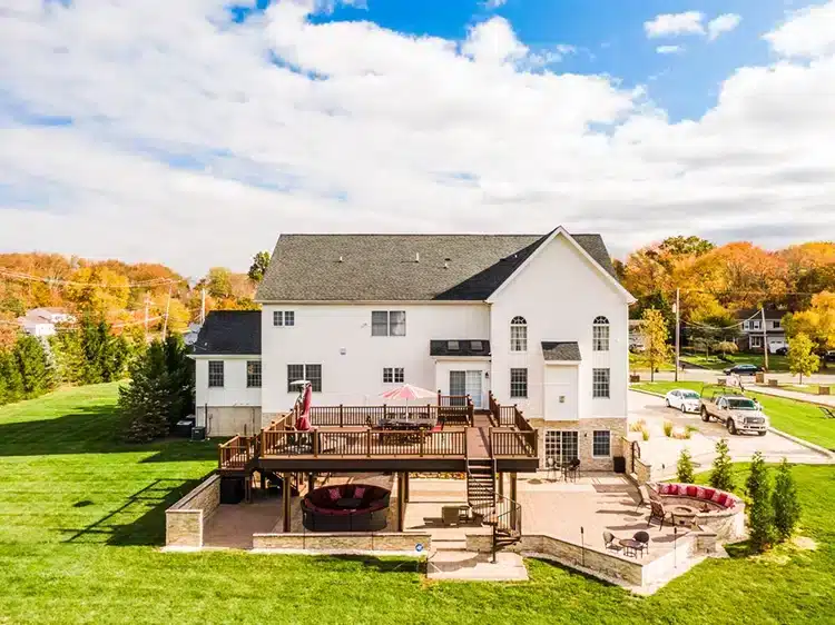 Photo of Wood-Like Composite Decking Post Wraps on an elaborate deck and patio paver